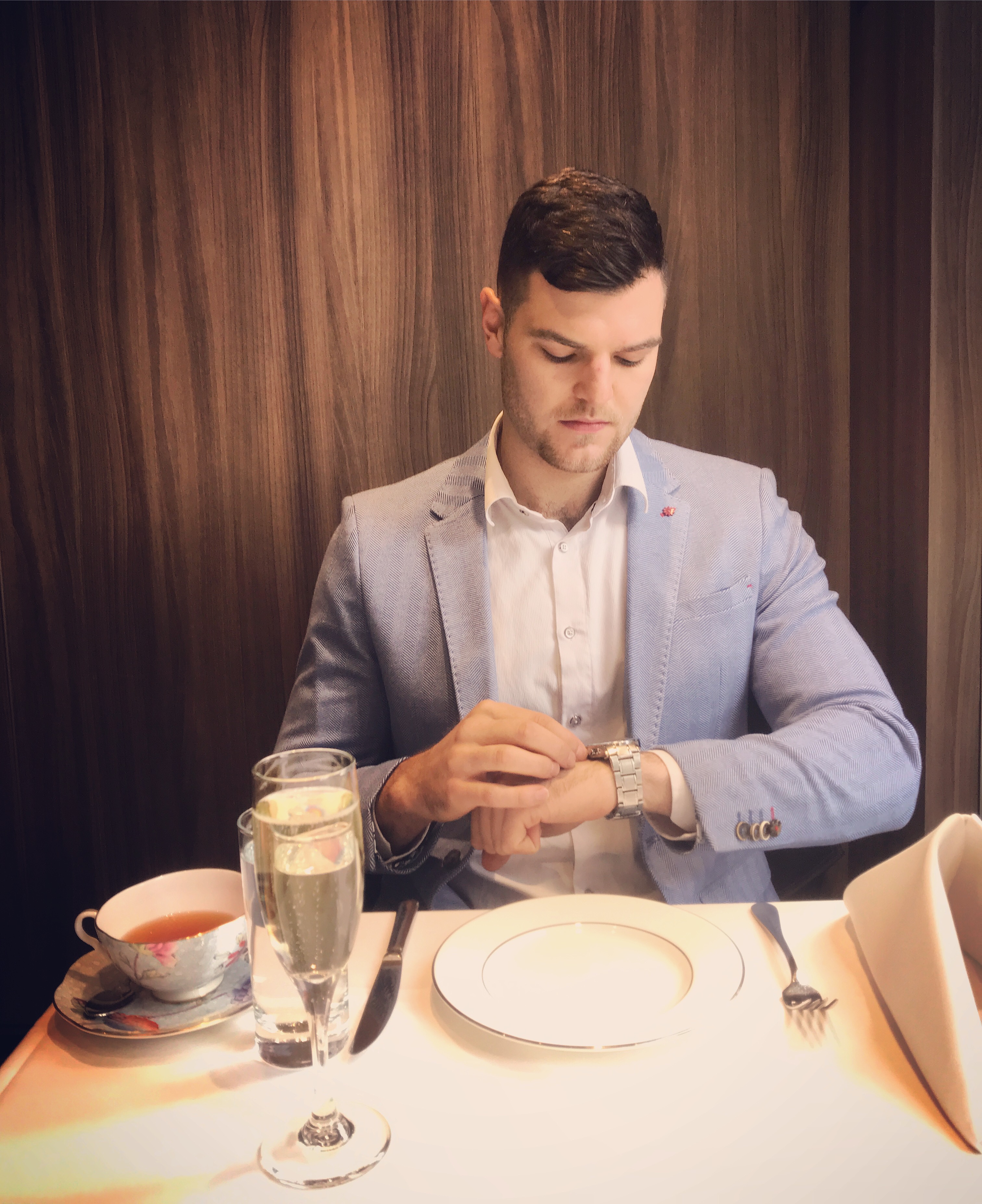 Bryce Huston seated at dinner in a blazer